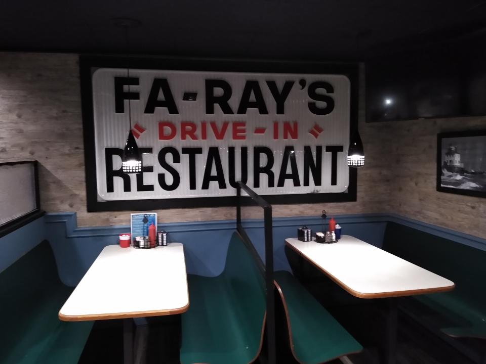 A sign from the original 1949 drive-in decorates a wall at Fa-Ray’s Family Restaurant in Barberton.
