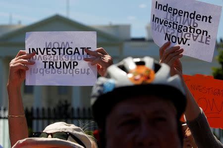 Protesters gather to rally against U.S. President Donald Trump's firing of Federal Bureau of Investigation (FBI) Director James Comey, outside the White House in Washington, U.S. May 10, 2017. REUTERS/Jonathan Ernst