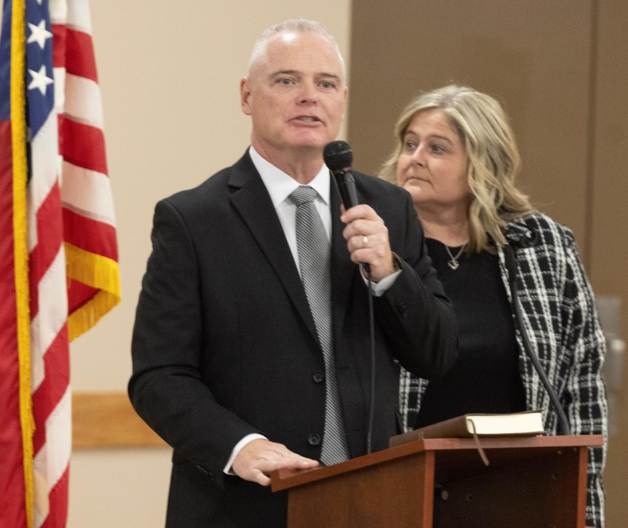 Jamie Slutz addresses family and friends while being sworn in Saturday night as mayor of Massillon at the Massillon Fraternal Order of Eagles No. 190. Slutz's choice for safety-service director, Renee Baker (right), is also pictured.