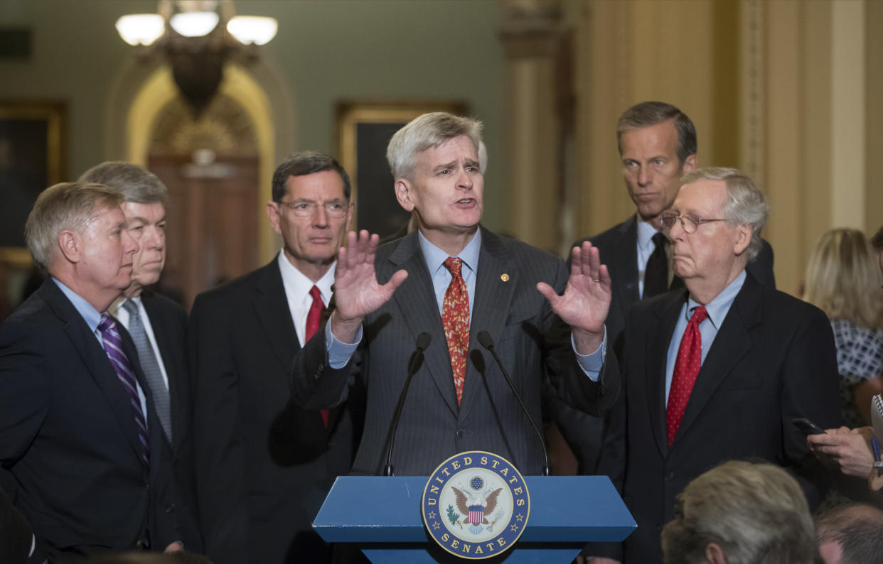 Sen. Bill Cassidy, R-La., center, joined by, from left, Sen. Lindsey Graham, R-S.C., Sen. Roy Blunt, R-Mo., Sen. John Barrasso, R-Wyo., Sen. John Thune, R-S.D., and Senate Majority Leader Mitch McConnell, R-Ky., speaks to reporters as he pushes a last-ditch effort to repeal Obamacare. (AP Photo/J. Scott Applewhite)