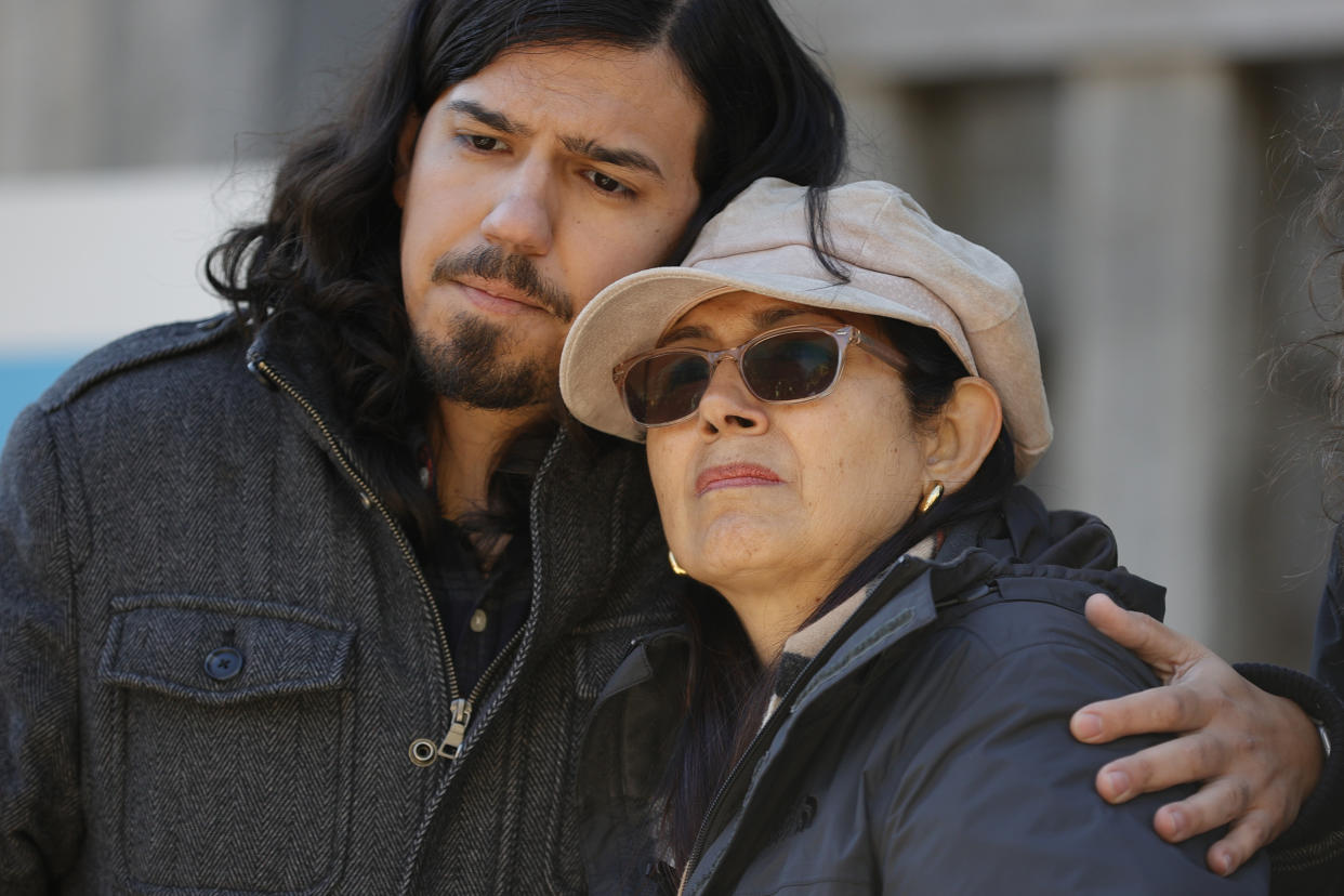 Daniel Paez, left, and Belkis Terán, right, family members of Manuel Esteban Paez Terán, embrace during a press conference, Monday, March 13, 2023, in Decatur, Ga. A press conference was held to give additional autopsy findings in Terán's death. (AP Photo/Alex Slitz)