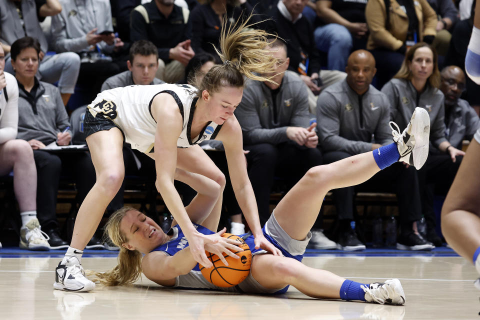 Middle Tennessee State's Savannah Wheeler (4) loses control of the ball while battling Colorado's Kindyll Wetta (15) during the second half of a first-round college basketball game in the NCAA Tournament, Saturday, March 18, 2023, in Durham, N.C. (AP Photo/Karl B. DeBlaker)