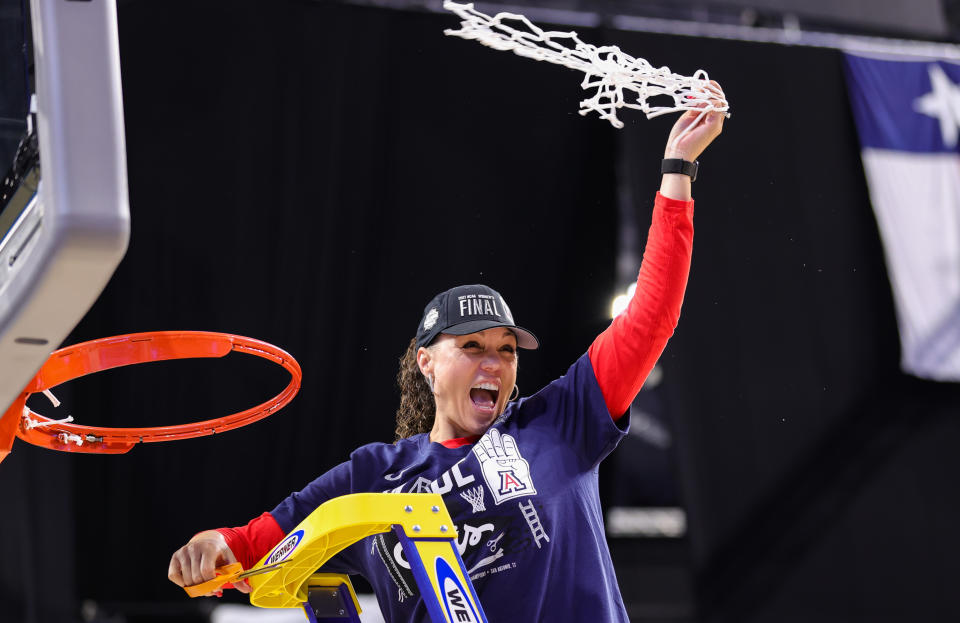 Adia Barnes holds the regional final net. 