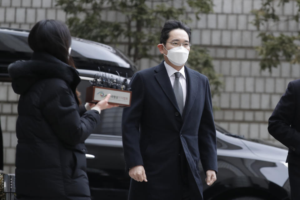 Samsung Electronics Vice Chairman Lee Jae-yong arrives at the Seoul High Court in Seoul, South Korea, Monday, Jan. 18, 2021. South Korean court sentences Lee to 2 and a half years in prison over corruption case. (AP Photo/Lee Jin-man)