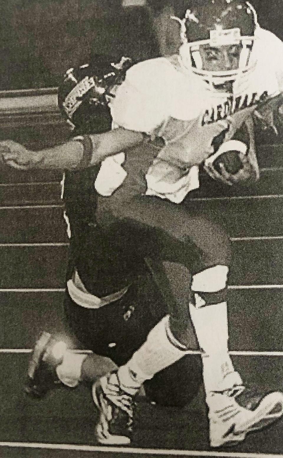 Arlington's Bumper Pickner attempts to break free from Stickney-Mount Vernon's Bo Hoffman during the 2005 state Class 9AA football championship in the DakotaDome. Arlington repeated as the state 9AA champions with a 39-14 win.