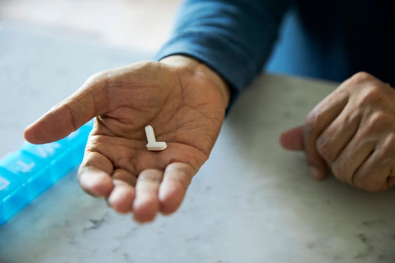 hand holding pills