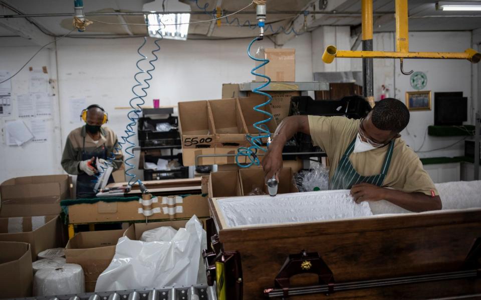 Coffins are being made to cope with a surge in the number of deaths - KIM LUDBROOK/EPA-EFE/Shutterstock