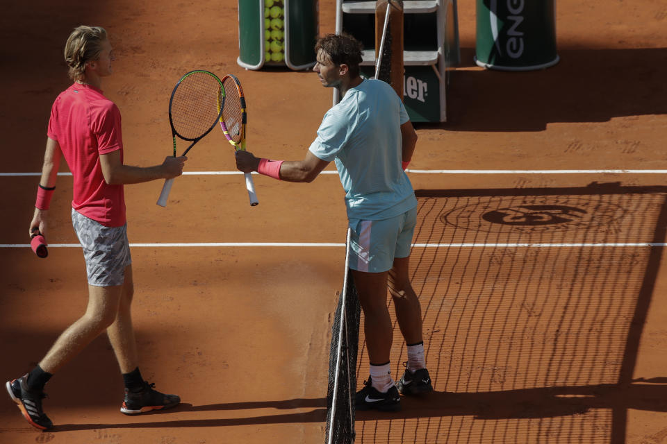 Sebastian Korda of the U.S. congratulates Spain's Rafael Nadal, right, with his win in the fourth round match of the French Open tennis tournament at the Roland Garros stadium in Paris, France, Sunday, Oct. 4, 2020. (AP Photo/Alessandra Tarantino)