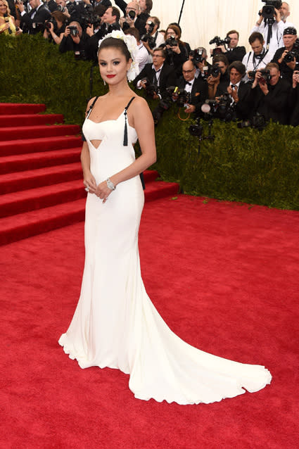 Looks like Justin Bieber still has his ex Selena Gomez on his mind. Justin and Selena both attended the 2015 Met Gala Monday night in New York City, and though the two didn't have a red carpet run in, Justin made sure everyone knew he was loving the "I Want You to Know" singer's sophisticated look. In a video posted by <em>TMZ</em>, Justin gives his comments on his ex, even though he is unprompted. "Hey, Selena looked gorgeous at the Met Ball!" he says as his car drives away. NEWS: Met Gala Afterparty Craziness! Katy Perry & John Mayer Back On, J. Law's Slinky Dress and Kylie Jenner's Sports Bra To his credit, Selena <em>did</em> look lovely, wearing a backless white Vera Wang gown and an elaborate white floral headpiece. Getty Images According to E! News, Justin and Selena spent a lot of time in the same room together at Rihanna's star-studded afterparty, though the two only "exchanged some words." Instead, Justin "spent most of his night dancing and having a great time with his friends" -- including Kendall Jenner -- while Selena also stuck by her gal pals. <em>Us Weekly</em> reports Selena did tequila shots and danced with her <em>Spring Breakers</em> co-star Vanessa Hudgens throughout the night. So is Selena -- who called the "Baby" singer her first love in an interview with <em>V </em>magazine in February -- so over their highly publicized on-again, off-again relationship? It would appear so. According to <em>Us Weekly</em>, a source says Justin "tried very hard" to speak with his ex at the party, but that "their encounter was pretty short." PHOTOS: Justin Bieber Responds to Selena Gomez Jokes at Roast Last month, he admitted that Selena inspired a lot of music on his new album. "I think a lot of my inspiration comes from [Selena]," he told Ryan Seacrest. "It was a long relationship that created heartbreak and created happiness and a lot of different emotions that I wanted to write about. There's a lot of that on this album." Watch below: