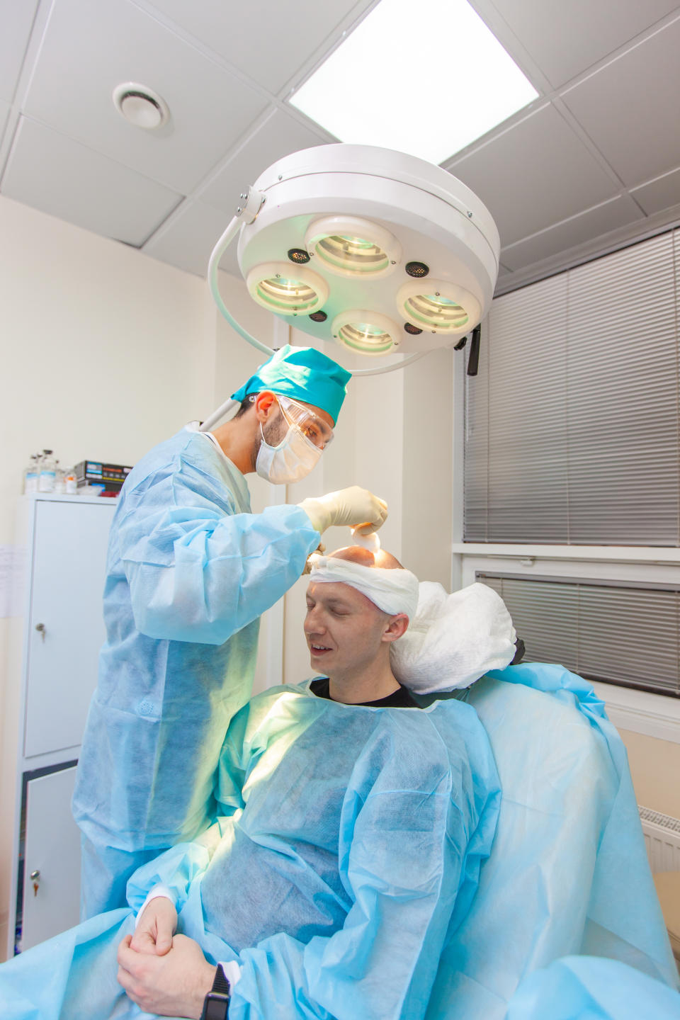 a man receiving an injection before his hair transplant