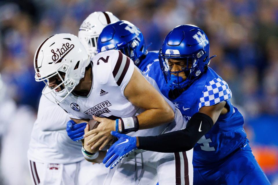 Kentucky defensive back Carrington Valentine, right, sacks Mississippi State quarterback Will Rogers (2) during the first half of an NCAA college football game in Lexington, Ky., Saturday, Oct. 15, 2022. (AP Photo/Michael Clubb)