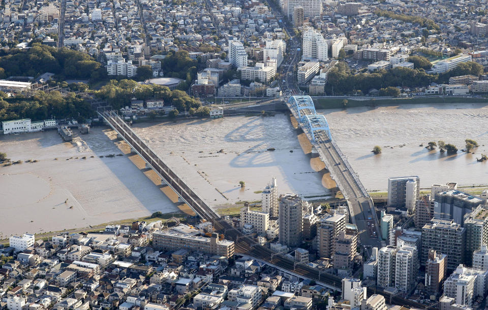 Residential areas are seen along with the swollen Tama River after Typhoon Hagibis hit the area in Kawasaki, near Tokyo,  Japan, Oct. 13, 2019. (Photo: Takuya Inaba/Kyodo News via AP)