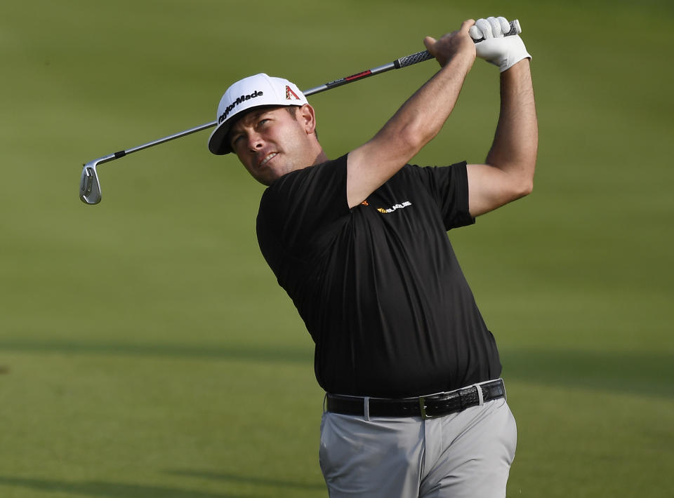 Chez Reavie hits his second shot on the 18th hole during the third round of the Travelers Championship golf tournament, Saturday, June 22, 2019, in Cromwell, Conn. (AP Photo/Jessica Hill)