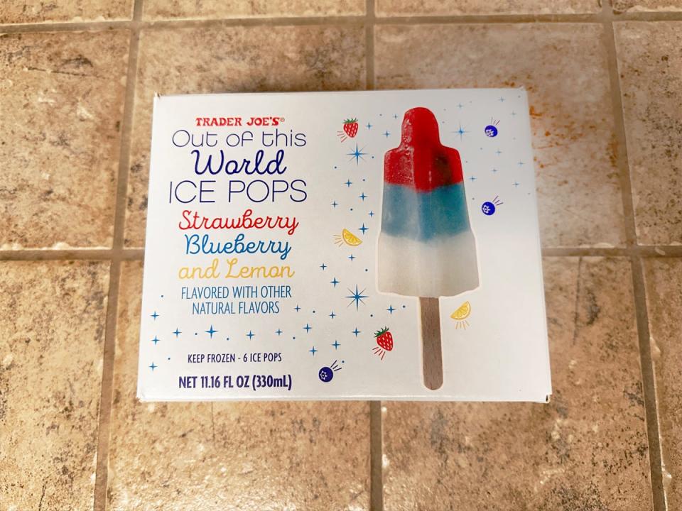 A white box with text reading "Out of this World" ice pops and an image of a red, blue, and white layered ice pop