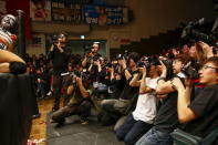 Members of the media take pictures of Holidead during a Stardom female professional wrestling show at Korakuen Hall in Tokyo, Japan, December 23, 2015. REUTERS/Thomas Peter