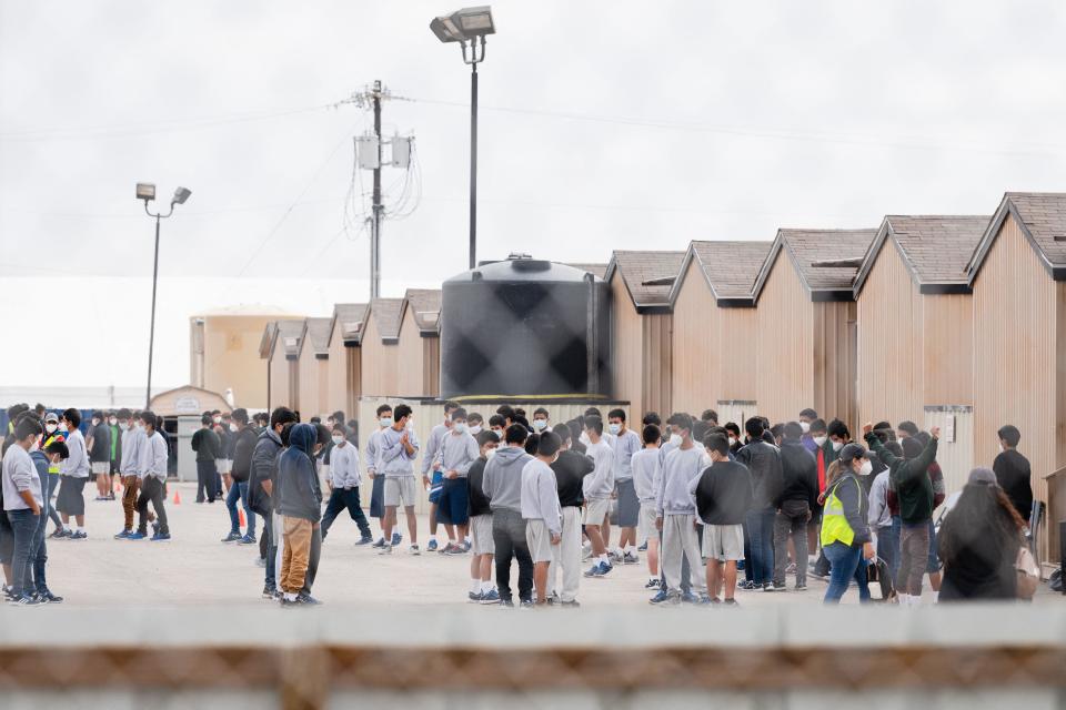 Migrant youths are seen inside a temporary housing facility in Midland, Texas, on April 5, 2021. / Credit: JUSTIN HAMEL/AFP via Getty Images