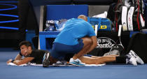 Tennis - Australian Open - Margaret Court Arena, Melbourne, Australia, January 20, 2018. Serbia's Novak Djokovic receives medical attention during a break in his match against Spain's Albert Ramos-Vinolas. REUTERS/Issei Kato