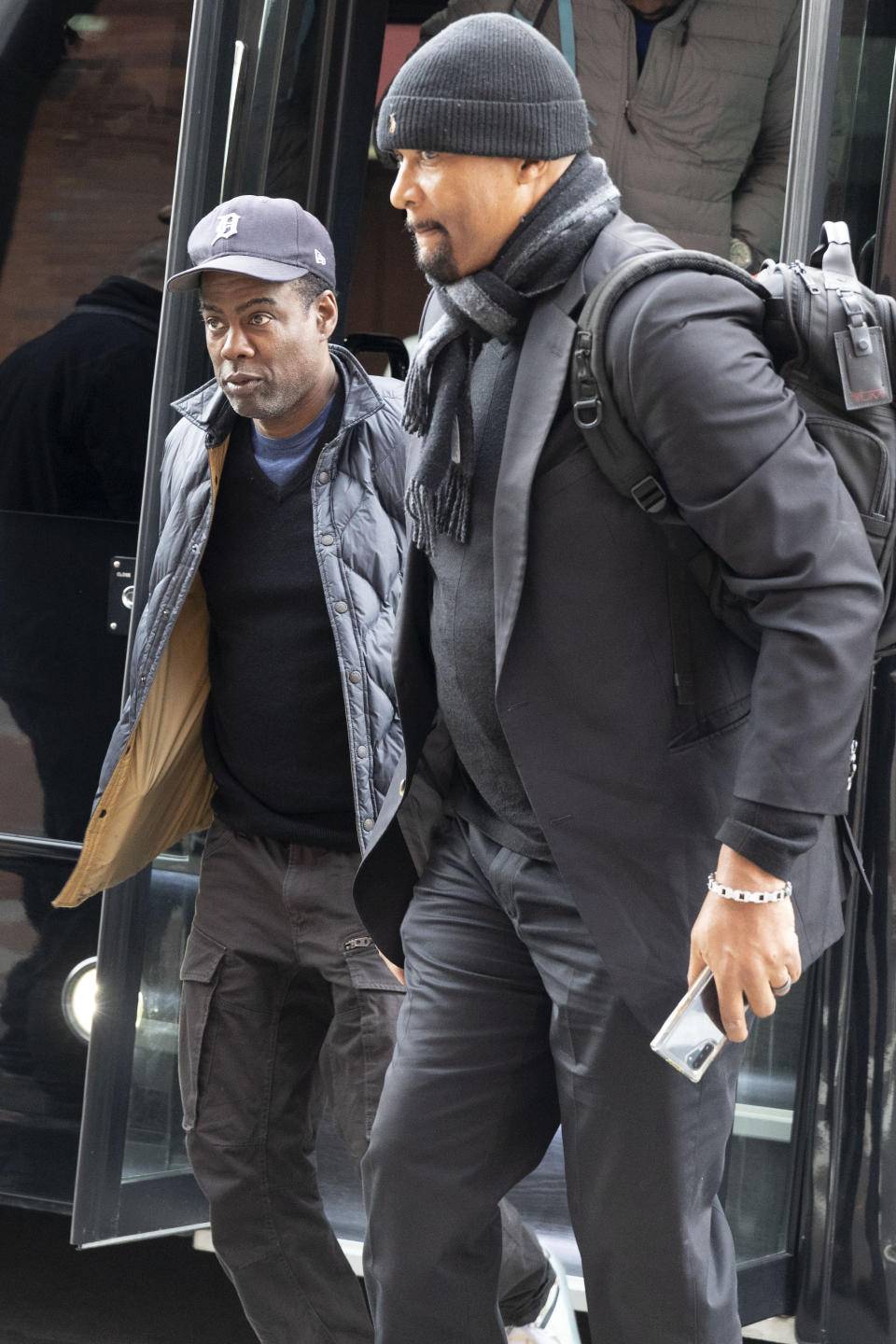 Chris Rock, left, arrives at the Wilbur Theater before a performance, Wednesday, March 30, 2022, in Boston. (AP Photo/Michael Dwyer)