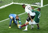 <p>Manuel Neuer of Germany makes a save from Hugo Ayala of Mexico, as Jerome Boateng of Germany protects the ball during the 2018 FIFA World Cup Russia group F match between Germany and Mexico at Luzhniki Stadium on June 17, 2018 in Moscow, Russia. (Photo by Matthias Hangst/Getty Images) </p>