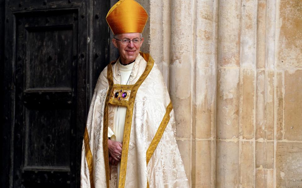 Archbishop of Canterbury Justin Welby waits to receive guests at Westminster Abbey ahead of the Coronation of King Charles III and Queen Camilla on May 6, 2023