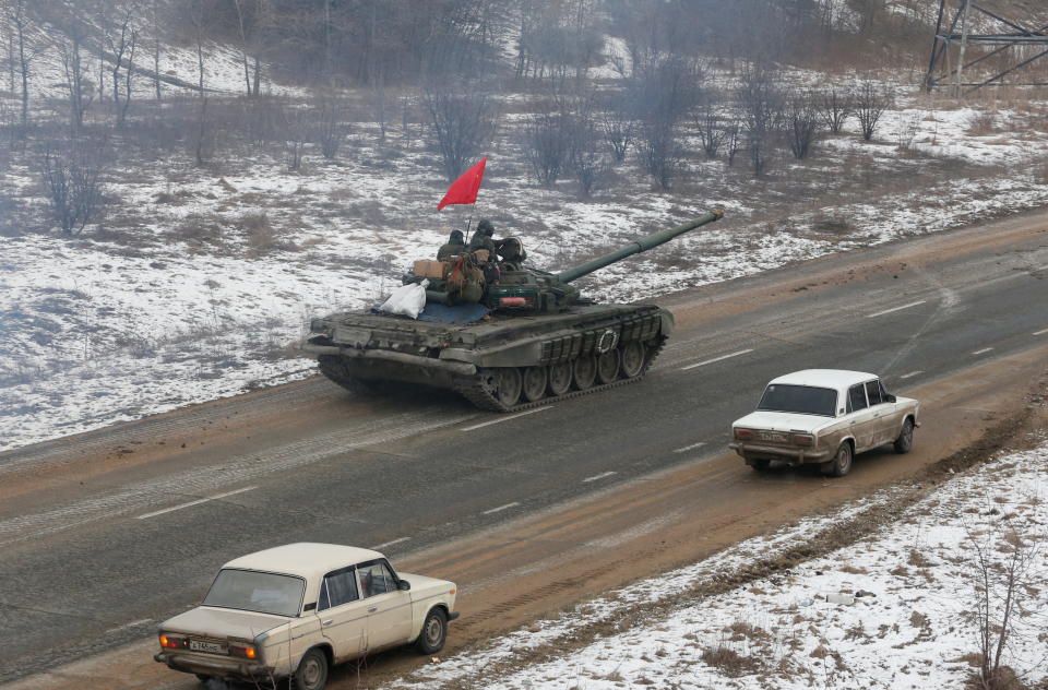 Service members of pro-Russian troops in uniforms without insignia drive a tank during Ukraine-Russia conflict on the outskirts of separatist-controlled city of Donetsk, Ukraine March 5, 2022. REUTERS/Alexander Ermochenko