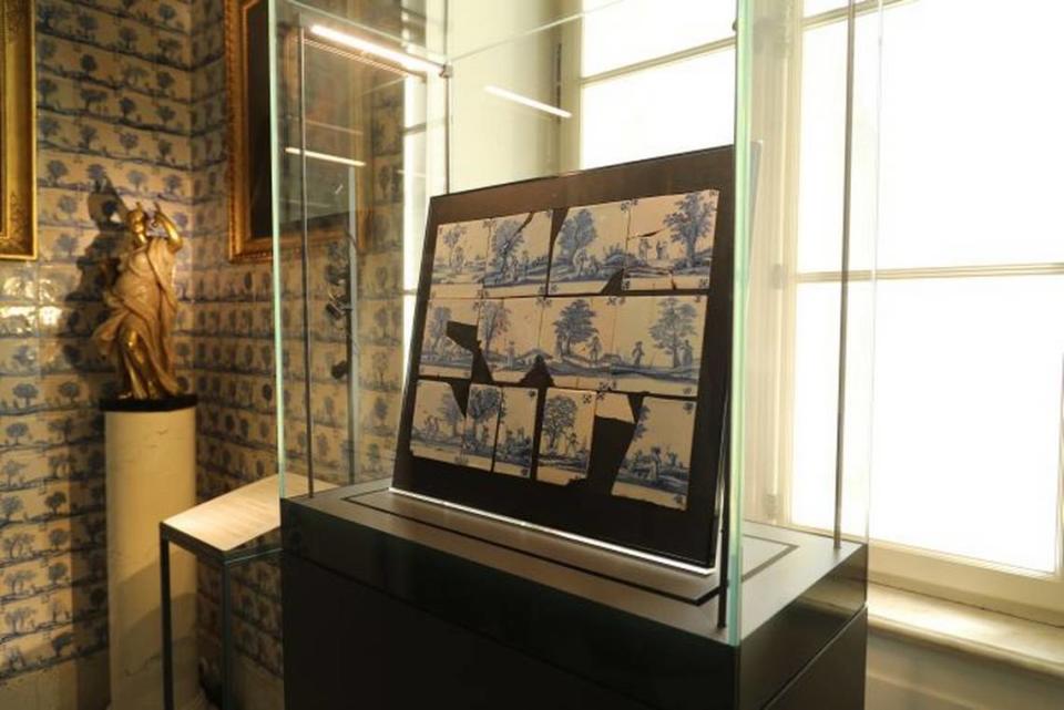 One dozen original ceramic tiles, made around 1690, were found inside the package, museum officials said.