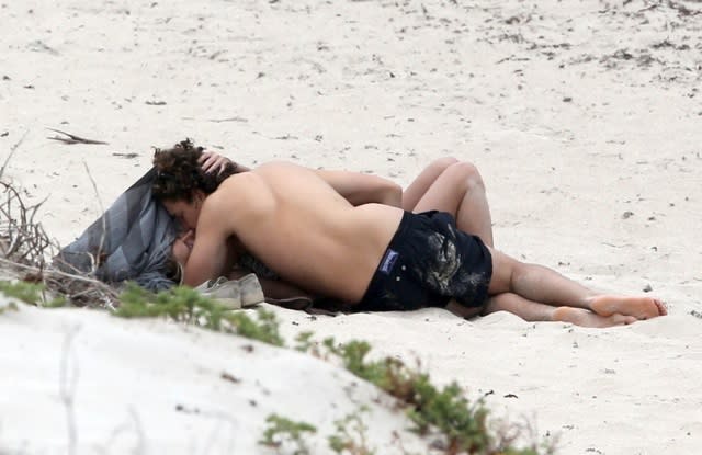 Looks like Heidi Klum and her 28-year-old boyfriend Vito Schnabel are getting along just fine!! The couple was photographed in St. Barts on Sunday getting very acquainted with one another while tanning on the beach. FameFlynet <strong>PHOTOS: Hollywood's Hottest Bikini Bods! </strong> Yes, we promise that Heidi is somewhere underneath that 28-year-old man making out. The two look to be in an absolute state of paradise as Heidi takes a break from appearing on <em>Germany's Next Topmodel. </em> <strong>WATCH: 7 Most Expensive Celebrity Divorces</strong> FameFlynet Heidi officially divorced her ex-husband, Seal, in October 2014, following two years of separation. Heidi dated her bodyguard Martin Kristen for 18 months until January 2014, and moved onto current beau Vito soon after. Glad to see the two are still very publicly all about each other! <strong>WATCH: How Heidi Klum Transforms Into a Supermodel </strong>