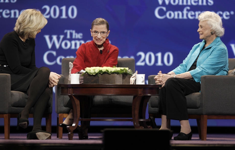 FILE - From left, Diane Sawyer, the honorable Ruth Bader Ginsburg and the honorable Sandra Day O'Connor, are seen on stage at the Women's Conference Tuesday, Oct. 26, 2010, in Long Beach, Calif. Ginsburg began wearing gloves in the the late 1990s after she was treated for colon cancer. Justice Sandra Day O’Connor, the Supreme Court's first female justice, suggested them as a way to prevent illness while shaking hands, but Ginsburg liked gloves so much she just kept wearing them. (AP Photo/Jae C. Hong, File)