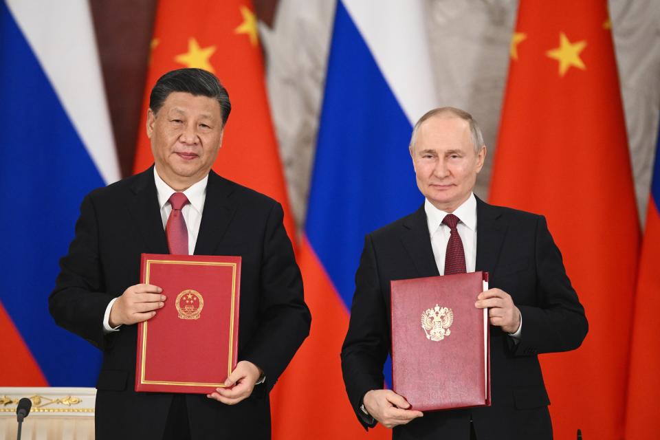 Russian President Vladimir Putin, right, and Chinese President Xi Jinping pose for a photo during a signing ceremony foillowing their talks at The Grand Kremlin Palace, in Moscow, Russia, Tuesday, March 21, 2023. (Vladimir Astapkovich, Sputnik, Kremlin Pool Photo via AP)