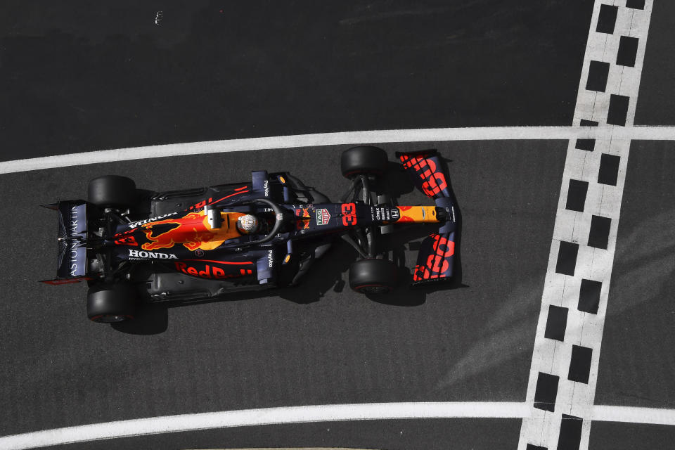 Red Bull driver Max Verstappen of the Netherlands enters the pit lane after he clocked the third fastest time during the qualifying session for the British Formula One Grand Prix at the Silverstone racetrack, Silverstone, England, Saturday, Aug. 1, 2020. The British Formula One Grand Prix will be held on Sunday. (Ben Stansall/Pool via AP)