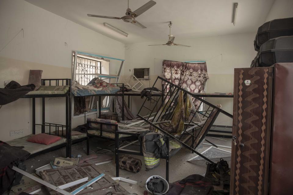 Debris remains in a room after a deadly attack on the Sheikh Othman police station, in Aden, Yemen, Thursday, Aug. 1, 2019. Yemen's rebels fired a ballistic missile at a military parade Thursday in the southern port city of Aden as coordinated suicide bombings targeted the police station in another part of the city. The attacks killed over 50 people and wounded dozens. (AP Photo/Nariman El-Mofty)