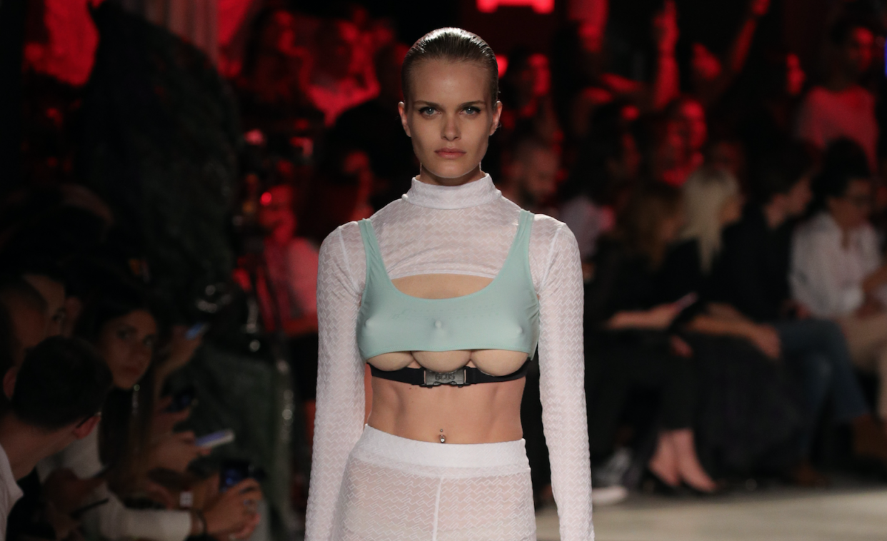 Models with three breasts walk the runway. (Photo: Getty Images)