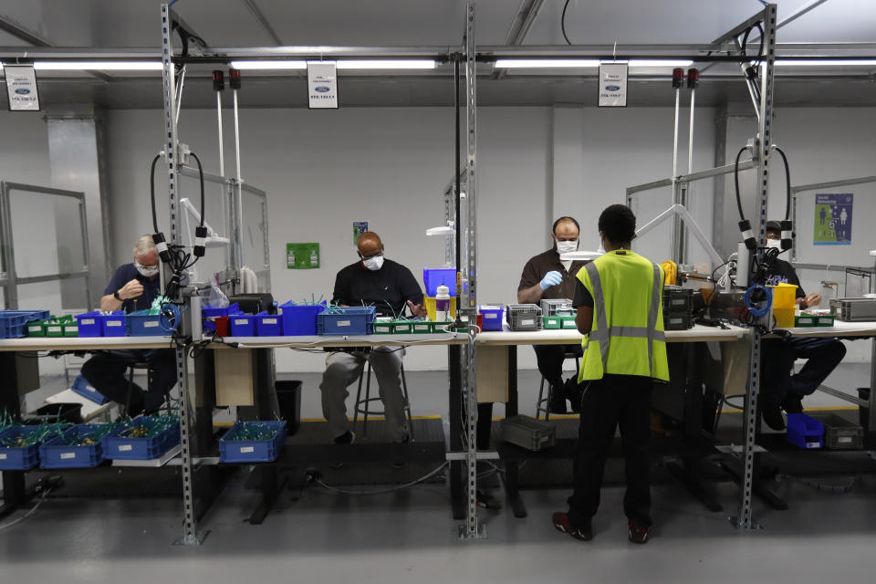 Ford Motor Co., team leader, Stephon Robinson who oversees workers on the subassembly line of ventilator production at the Ford Rawsonville plant, Wednesday, May 13, 2020 in Ypsilanti Township, Mich. The plant was converted into a ventilator factory, as hospitals battling the coronavirus report shortages of the life-saving devices. The company has promised to deliver 50,000 by July 4. Beginning Monday, will phase back into producing automotive components. (AP Photo/Carlos Osorio)