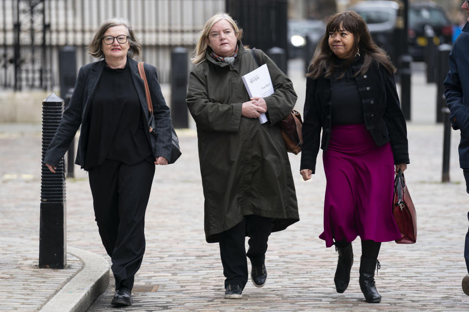 Baroness Louise Casey, center, arrives at the Queen Elizabeth II Conference Centre, London, Monday March 20, 2023, with members of the review team, Sarah Kincaid, left, and Diane Coddle, to attend the press briefing of the review into the standards of behaviour and internal culture of the Metropolitan Police Service, commissioned in the wake of the murder of Sarah Everard by a serving officer. (Kirsty O'Connor/Pool via AP)