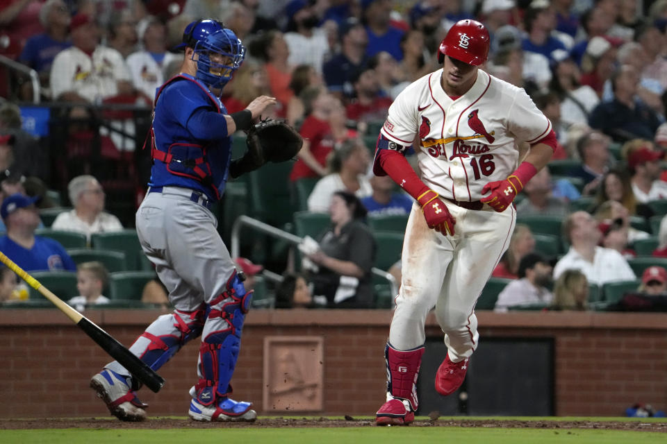 St. Louis Cardinals' Nolan Gorman, right, tosses his bat after flying out with the bases loaded as Chicago Cubs catcher Yan Gomes watches to end the third inning of a baseball game Saturday, July 29, 2023, in St. Louis. (AP Photo/Jeff Roberson)