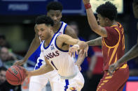 Kansas guard Devon Dotson (1) steals the ball from Iowa State guard Prentiss Nixon (11) during the first half of an NCAA college basketball game in Lawrence, Kan., Monday, Feb. 17, 2020. (AP Photo/Orlin Wagner)