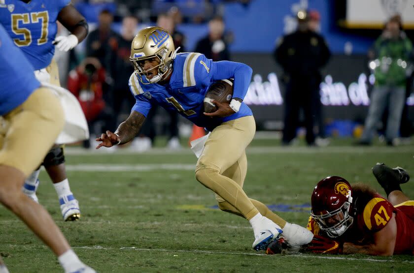 UCLA quarterback Dorian Thompson-Robinson runs against rival USC.