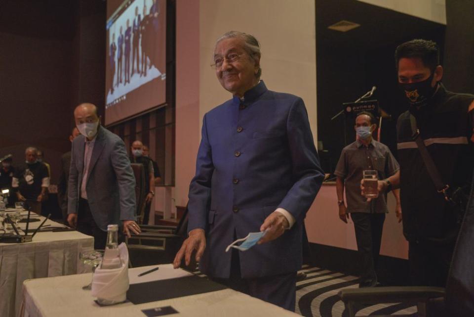 Datuk Seri Mukhriz Mahathir (left) and Tun Dr Mahathir Mohamad arrive for a media conference at the Pullman Kuala Lumpur in Bangsar August 7, 2020. — Picture by Shafwan Zaidon