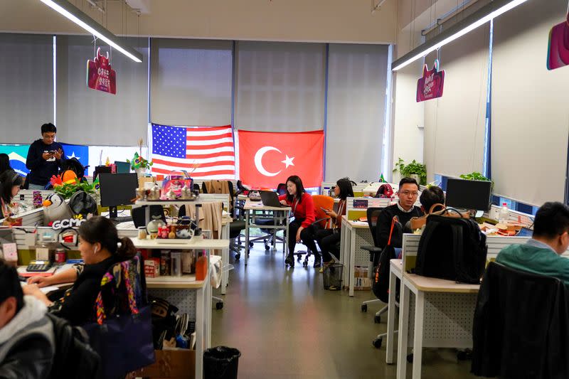 Employees work at AliExpress office at the Alibaba company's headquarters in Hangzhou