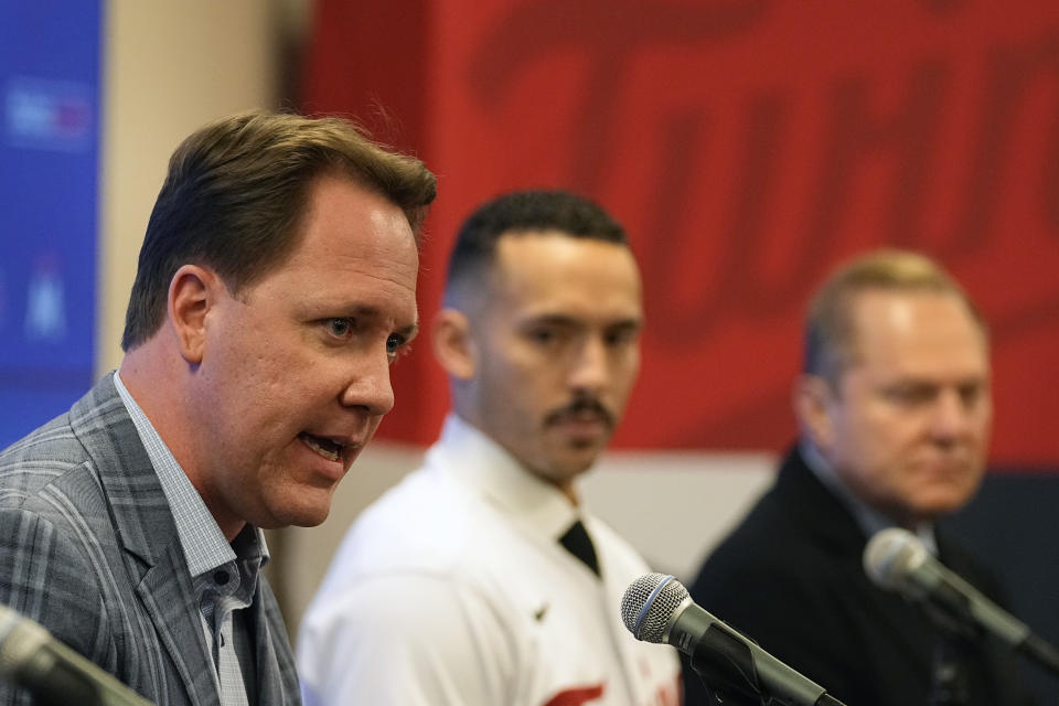 Minnesota Twins' president of baseball operations Derek Falvey, left, takes questions alongside Twins' Carlos Correa, center, and agent Scott Boras during a baseball press conference at Target Field, Wednesday, Jan. 11, 2023, in Minneapolis. The team and Correa agreed to a six-year, $200 million contract. (AP Photo/Abbie Parr)