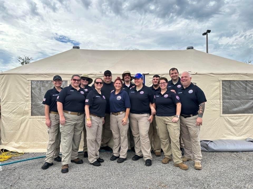 West Licking Joint Fire District EMS Coordinator Ginger Wortman (appearing in the back row, second to the left) went on a deployment to Florida in the aftermath of hurricane Ian, where she helped build and provide medical services in a makeshift emergency room system.