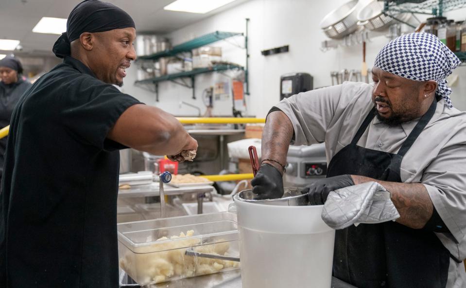 Chef de Cuisine Jermaine Mills works with prep cook John Rob at Vigilante Kitchen, which opened on June 30, 2023. This has been the dream of executive chef and owner Aaron Cozadd, who has conceptualized an immersive venue that encompasses Zen vibes, punk rock and graphic novels.