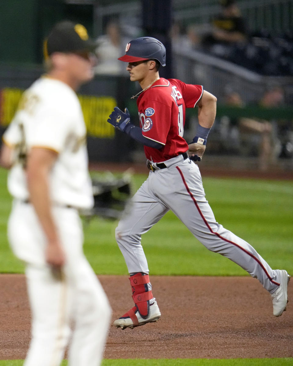 Washington Nationals' Drew Millas runs the bases on a solo home run off Pittsburgh Pirates relief pitcher Quinn Priester, left, during the fifth inning of a baseball game in Pittsburgh, Wednesday, Sept. 13, 2023. (AP Photo/Gene J. Puskar)