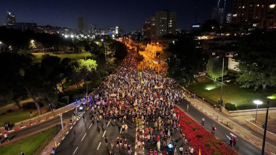 People march on the street as anti-government protesters mark nine months since the deadly October 7 attack, under the slogan "Israel comes to a standstill," outside Israeli Prime Minister Benjamin Netanyahu's private residence in Jerusalem on Sunday. - Ilan Rosenberg/Reuters