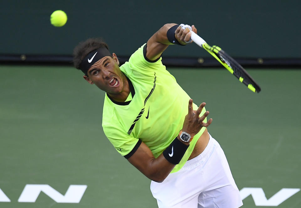 Rafael Nadal, of Spain, serves to Roger Federer, of Switzerland, at the BNP Paribas Open tennis tournament, Wednesday, March 15, 2017, in Indian Wells, Calif. (AP Photo/Mark J. Terrill)