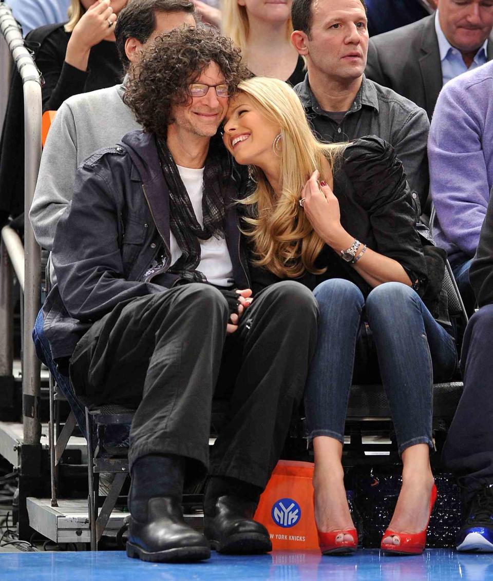 Howard Stern and Beth Ostrosky Stern and Piers Morgan (top R) attend the Miami Heat vs New York Knicks game at Madison Square Garden on January 27, 2011 in New York City.