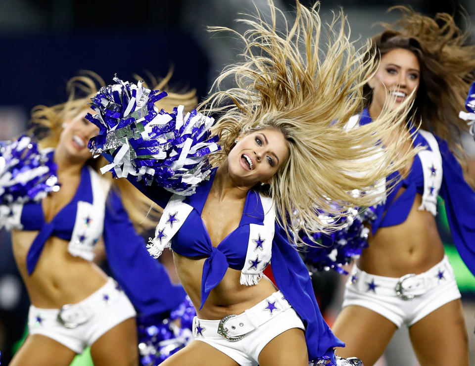 <p>The Dallas Cowboys Cheerleaders perform before the start of the football game against the Washington Redskins at AT&T Stadium on November 30, 2017 in Arlington, Texas. (Photo by Wesley Hitt/Getty Images) </p>