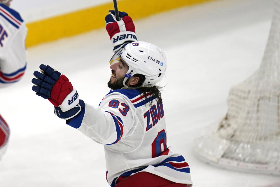 New York Rangers center Mika Zibanejad (93) raises his arms after scoring his second goal of the game during the third period of an NHL hockey game against the Boston Bruins, Saturday, May 8, 2021, in Boston. The Rangers defeated the Bruins 5-4. (AP Photo/Charles Krupa)