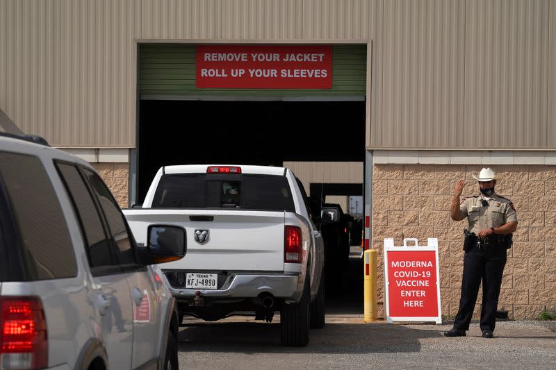 People are inoculated against coronavirus disease at a vaccination site in Robstown