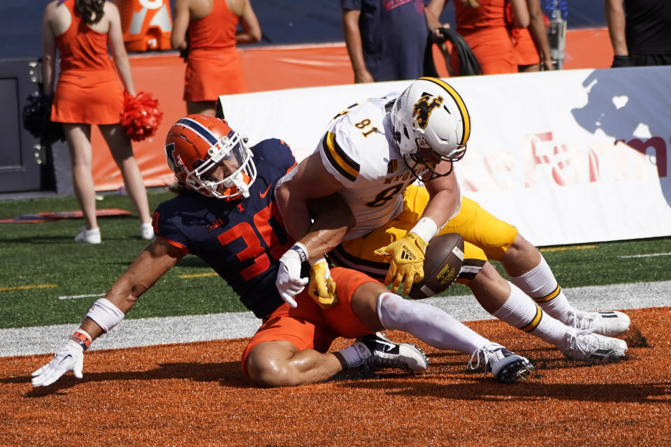 Illinois defensive back Sydney Brown (30) breaks up a pass intended for Wyoming tight end Treyton Welch during the first half of an NCAA college football game, Saturday, Aug. 27, 2022, in Champaign, Ill. (AP Photo/Charles Rex Arbogast)